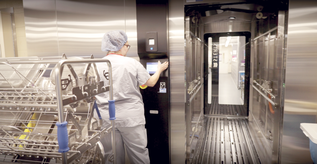 St. Mary's staff member operating the new surgical cart washer.