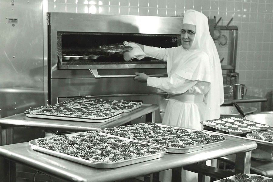 Sister Zita baking butter tarts at St. Mary's General Hospital